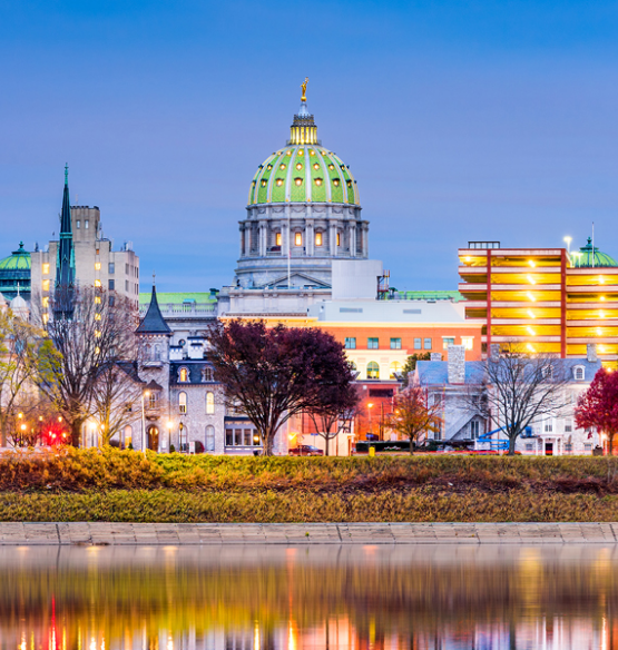 Downtown Harrisburg and the Pennsylvania State Capitol reflected in the Susquehanna River.